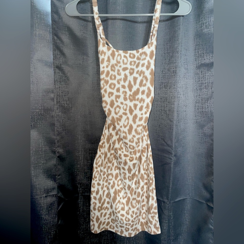 Mini cheetah print dress with open crossed back, perfect summer time dress 🐆